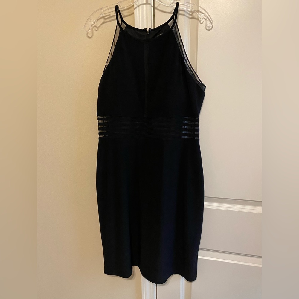 Black Halter Style Dress with sheer waist. Size 14 $35.00
